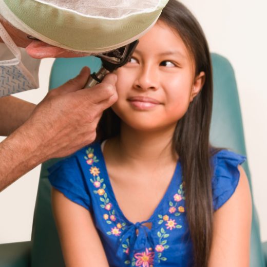 Doctor examining a child's eye.