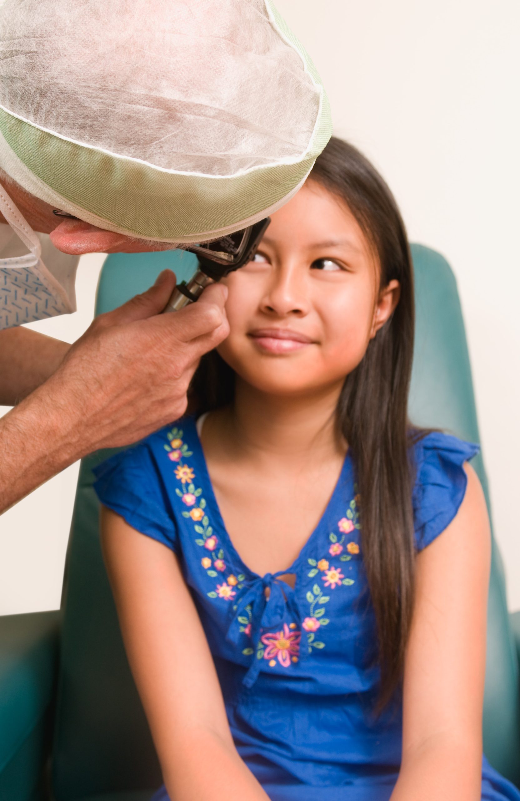 Doctor examining a child's eye.